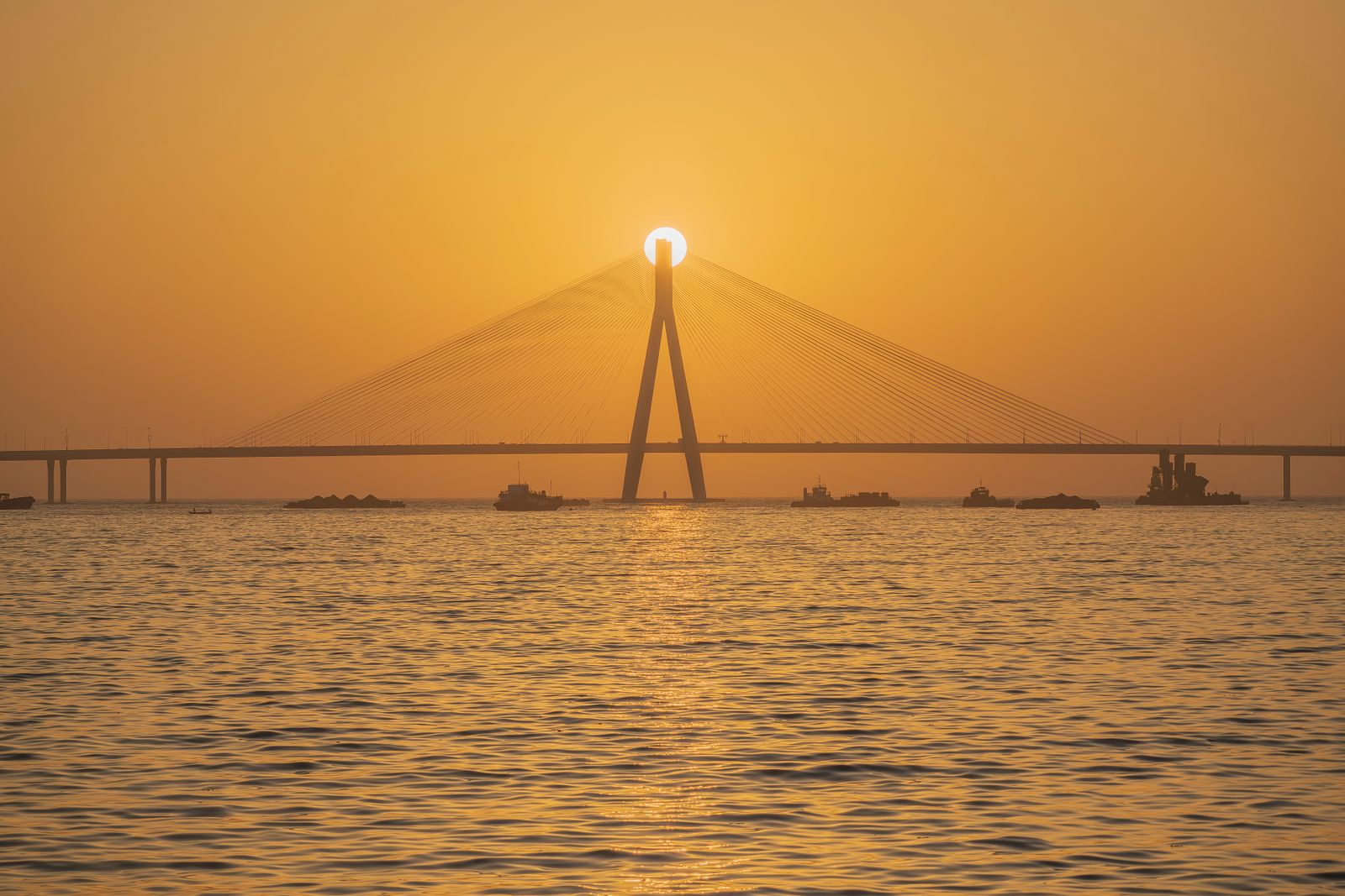 Gateway of India arch at Apollo Bunder with the Taj Mahal Palace domes behind it, Colaba